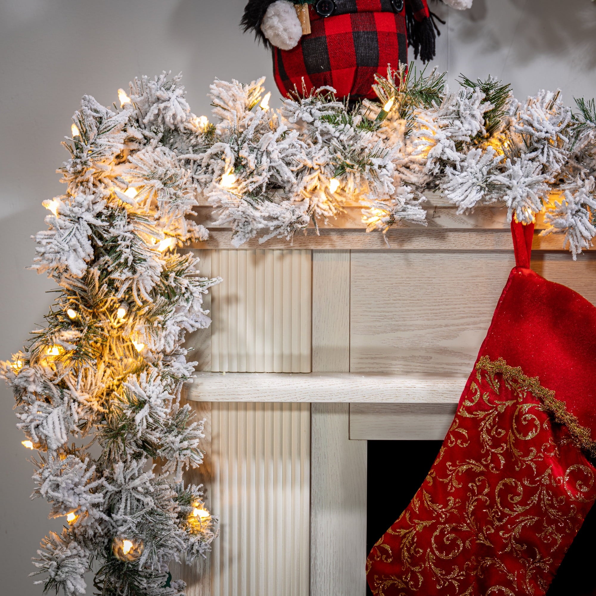 Gerson 9-Foot Long Pre-lit Heavily Flocked Spruce Garland with 100 UL Clear Lights